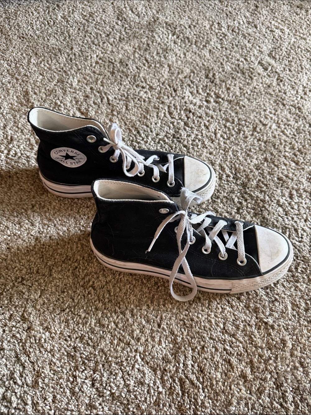 Converse women’s Black & White High Top Chuck Taylor Sneakers